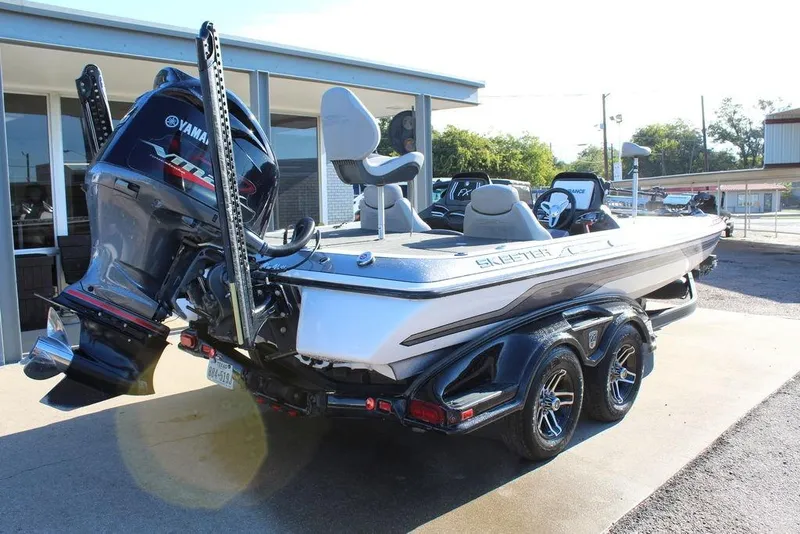Slide: The Image of 2016 Skeeter FX21 Limited Edition boat with Yamaha engine, parked on a trailer. - 5
