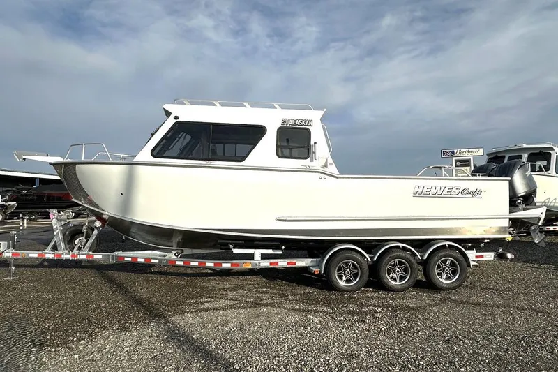 The Image of 2026 Hewescraft 270 Alaskan boat on a trailer, side view. - 1