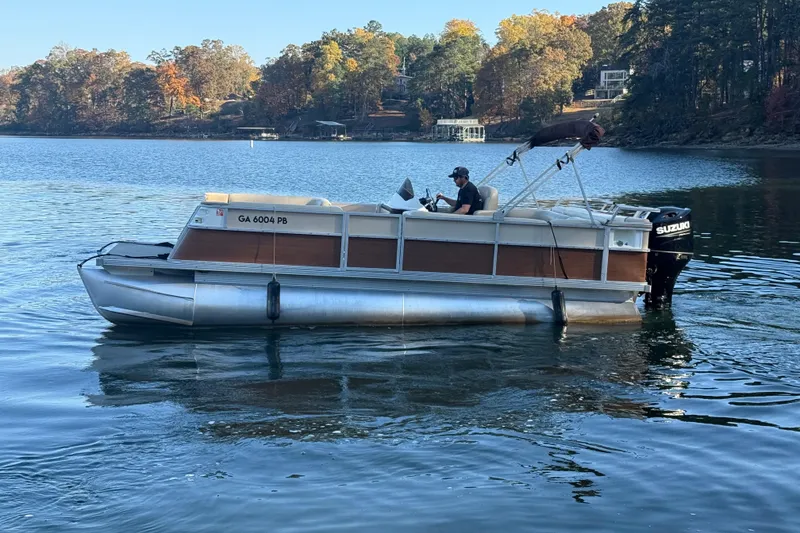 Slide: The Image of 1997 Crest CREST II DLX pontoon boat on a scenic lake with autumn foliage. - 10