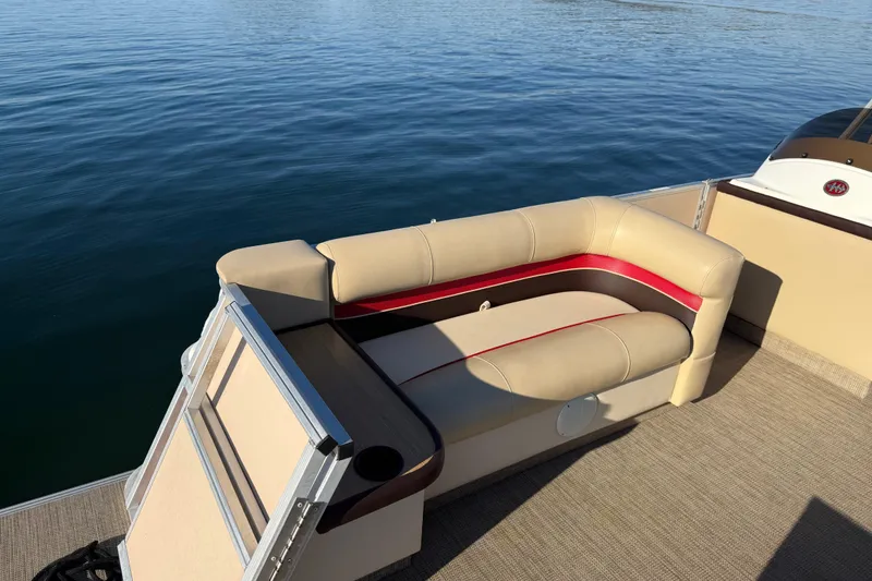 Slide: The Image of 1997 Crest CREST II DLX pontoon boat with beige and red seating on calm water. - 15