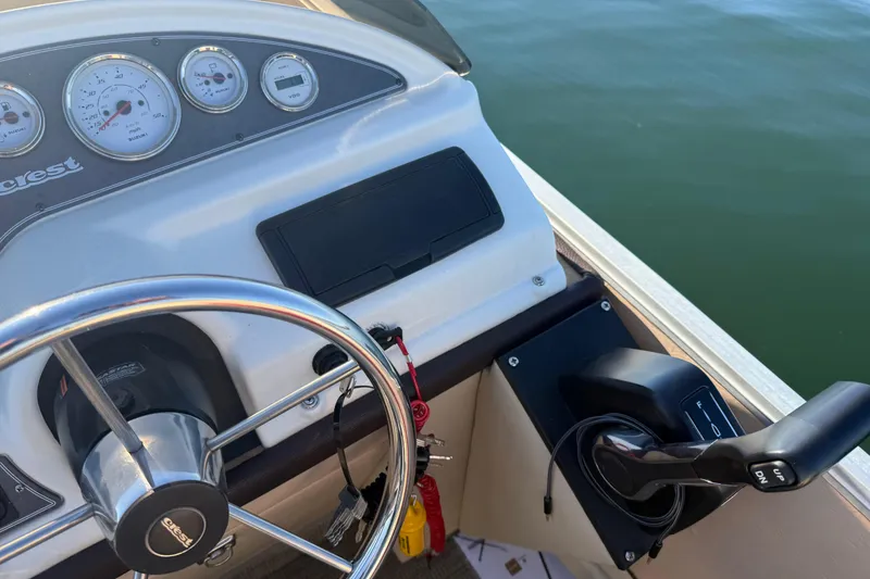 Slide: The Image of Steering console of a 1997 Crest CREST II DLX boat with gauges and throttle. - 20