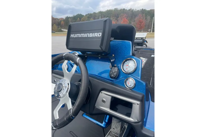 Slide: The Image of 2024 Nitro Z20 boat dashboard with Humminbird display and steering wheel. - 12