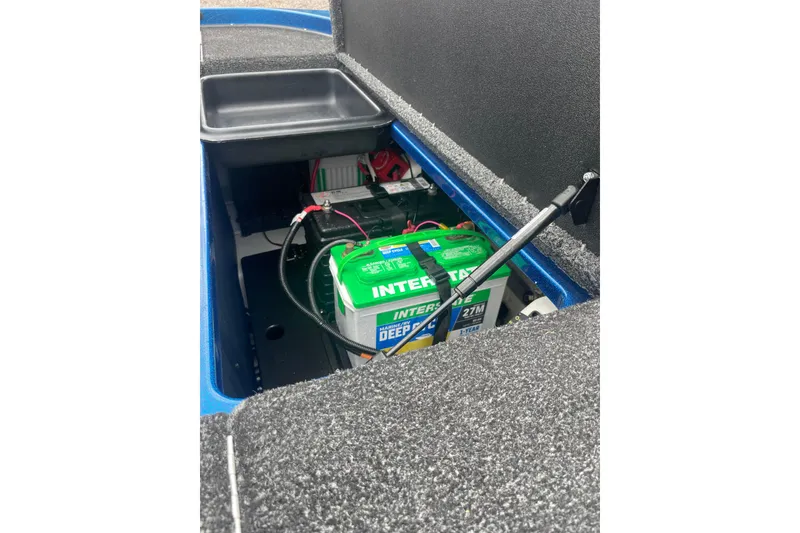 Slide: The Image of 2024 Nitro Z20 boat battery compartment with Interstate marine battery. - 16