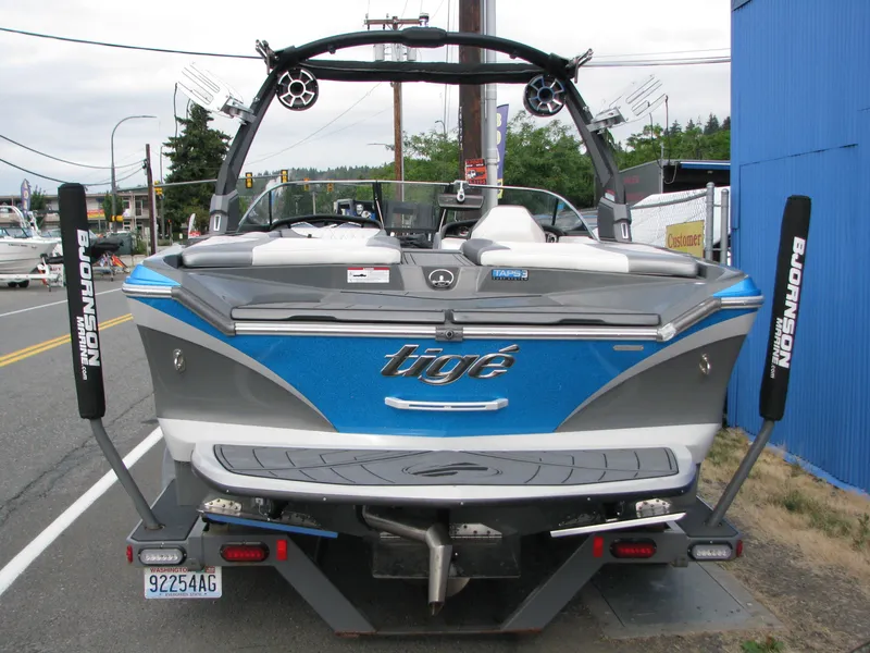 Slide: The Image of 2017 Tigé Z1 boat, blue and gray, parked on street, rear view. - 2