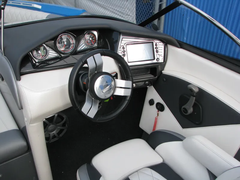 Slide: The Image of 2017 Tigé Z1 boat interior with modern dashboard and steering wheel. - 3