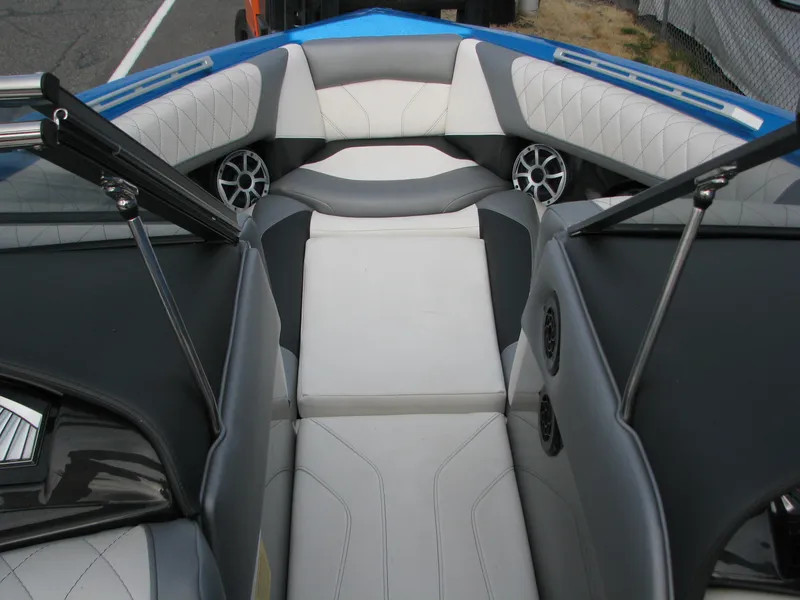 Slide: The Image of 2017 Tigé Z1 boat interior with gray and white seating, featuring speakers and sleek design. - 4