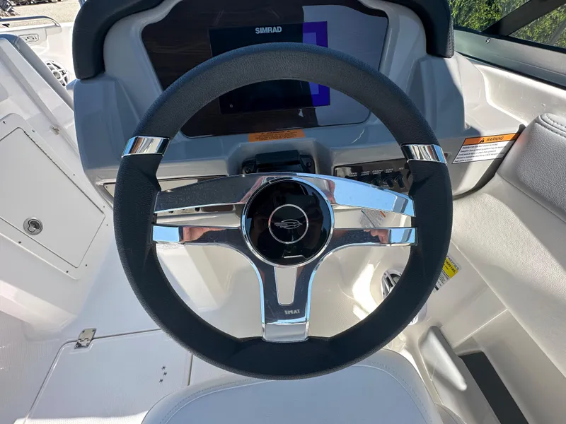 Slide: The Image of 2024 Chaparral 21 SSi OB boat steering wheel and dashboard. - 23