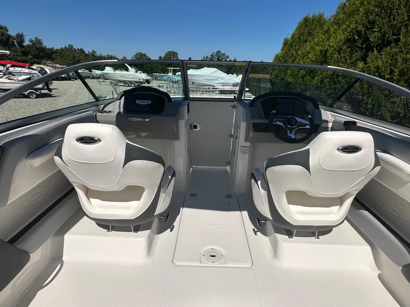 Slide: The Image of 2024 Chaparral 21 SSi OB boat interior with dual captain seats and dashboard. - 46