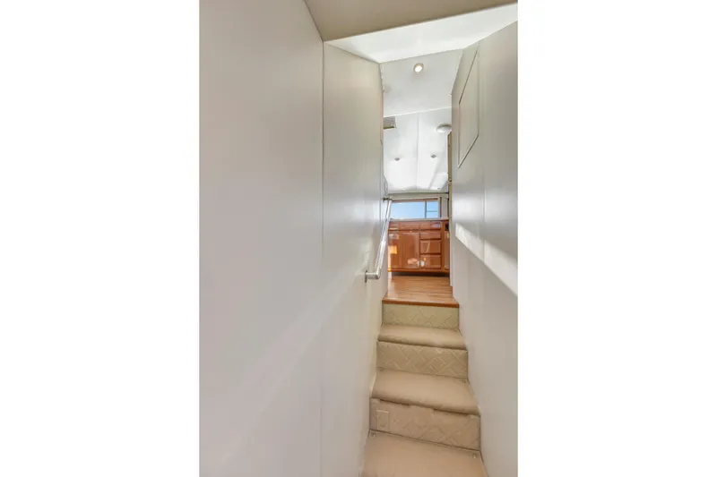 Slide: The Image of Interior staircase of 2001 Viking 50 Convertible yacht, leading to upper deck. - 18
