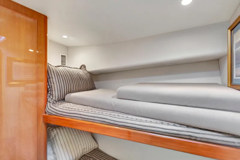 Slide: The Image of Interior of 2001 Viking 50 Convertible yacht with cozy bunk beds. - 21