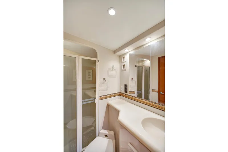 Slide: The Image of Bathroom interior of 2001 Viking 50 Convertible yacht with shower and vanity. - 25