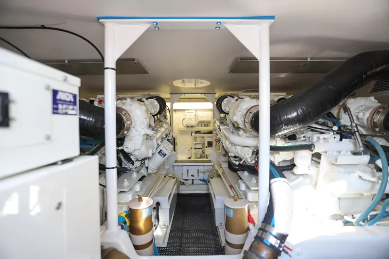 Slide: The Image of Engine room of 2001 Viking 50 Convertible yacht, showcasing dual engines and mechanical systems. - 29