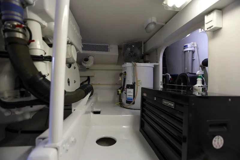 Slide: The Image of Engine room of 2001 Viking 50 Convertible yacht with tools and equipment. - 31