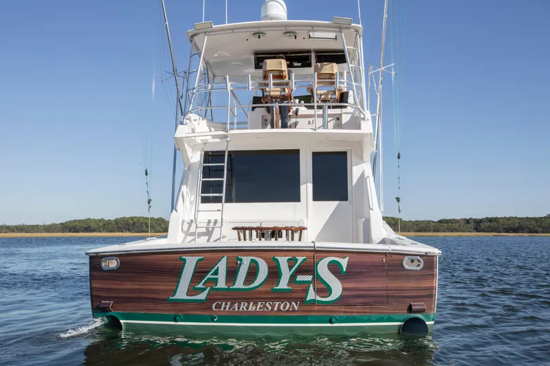 Slide: The Image of 2001 Viking 50 Convertible yacht "Lady-S" on water, rear view. - 4