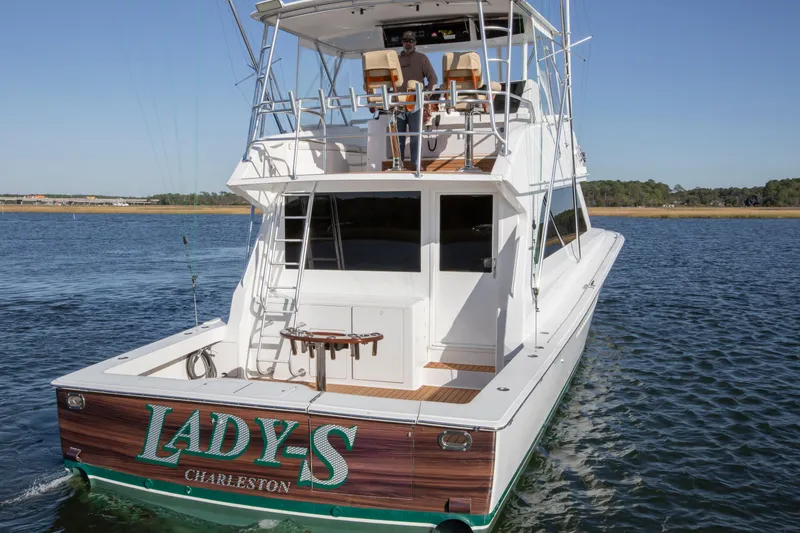 Slide: The Image of 2001 Viking 50 Convertible yacht "Lady S" on water, rear view, Charleston. - 5