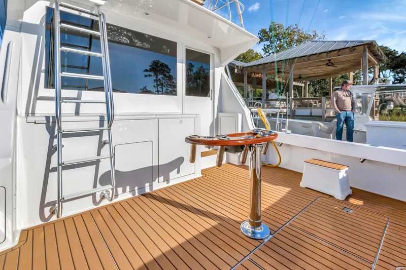 Slide: The Image of 2001 Viking 50 Convertible yacht deck with ladder and fishing station. - 6