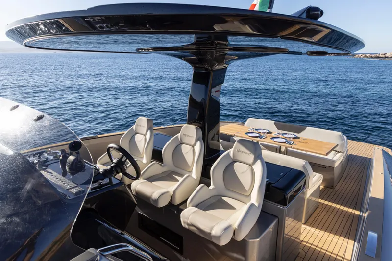 Slide: The Image of 2024 Solaris Power 40 Open yacht cockpit with luxurious seating and ocean view. - 13