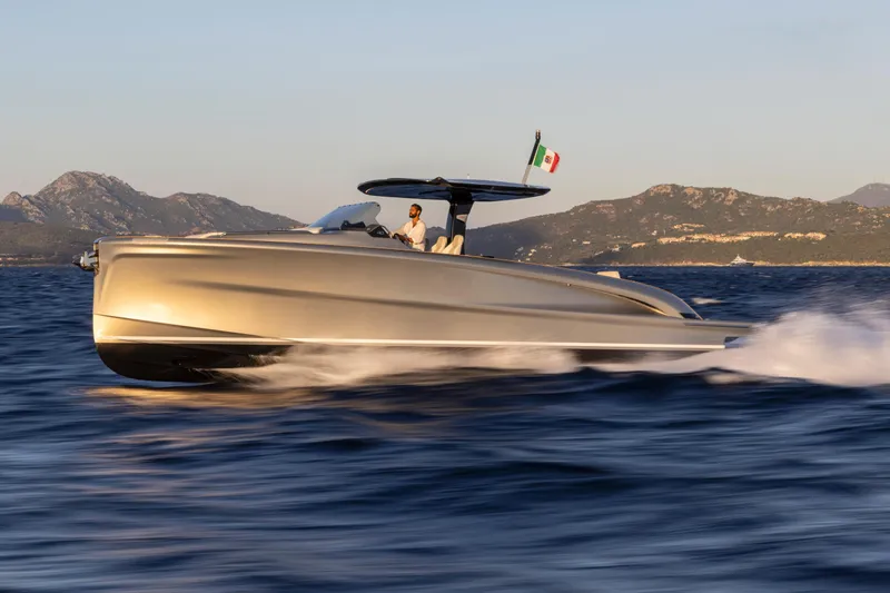 Slide: The Image of 2024 Solaris Power 40 Open luxury yacht cruising on the sea with scenic mountain backdrop. - 18