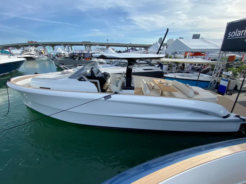 Slide: The Image of 2024 Solaris Power 40 Open luxury yacht docked at a marina. - 5