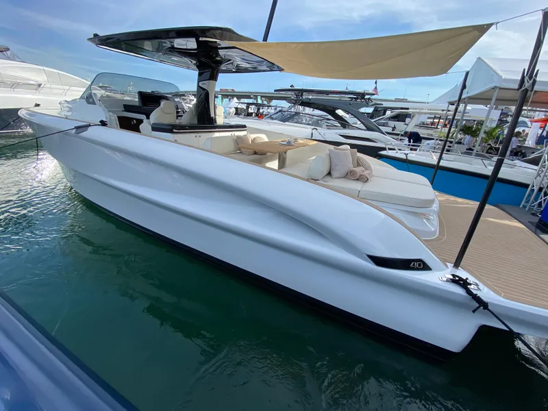 Slide: The Image of 2024 Solaris Power 40 Open luxury yacht docked at marina. - 6