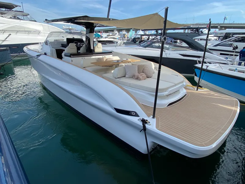 Slide: The Image of 2024 Solaris Power 40 Open luxury yacht docked at marina. - 7