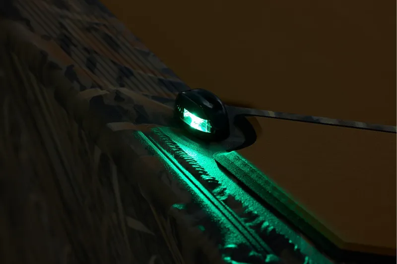 Slide: The Image of 2026 Tracker Grizzly 1756 T Marsh boat with illuminated green navigation light. - 16