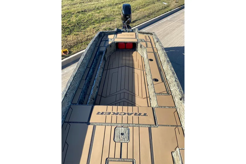 Slide: The Image of 2026 Tracker Grizzly 1756 T Marsh boat with camo design and spacious deck. - 4