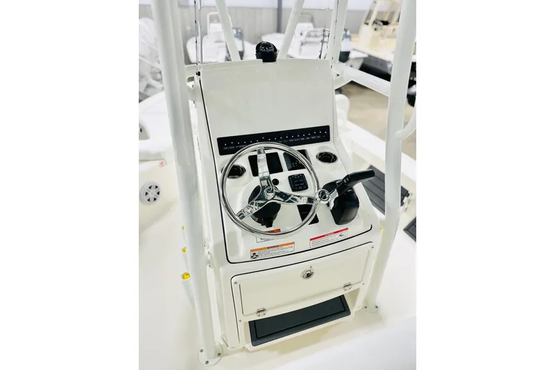 Slide: The Image of 2026 Pathfinder 2200 TRS boat console with steering wheel and controls. - 3