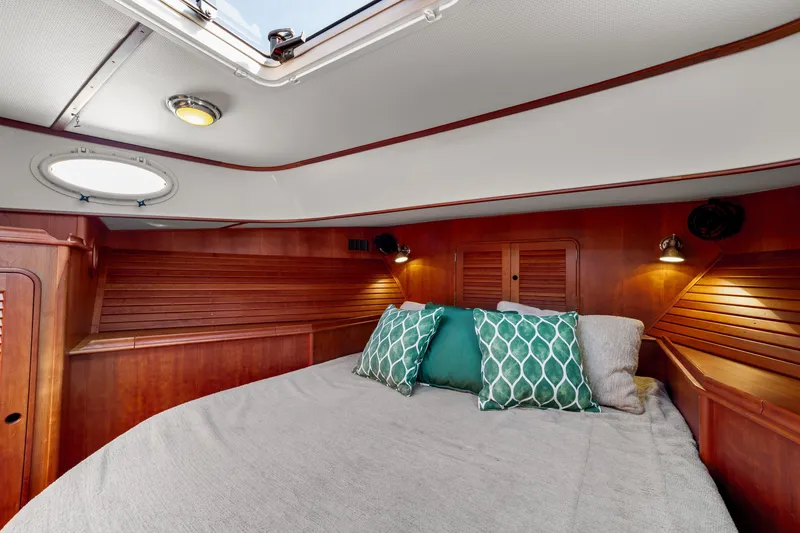 Slide: The Image of Luxurious cabin interior of 2002 Hinckley Talaria 44 Express yacht with elegant wood finish. - 41