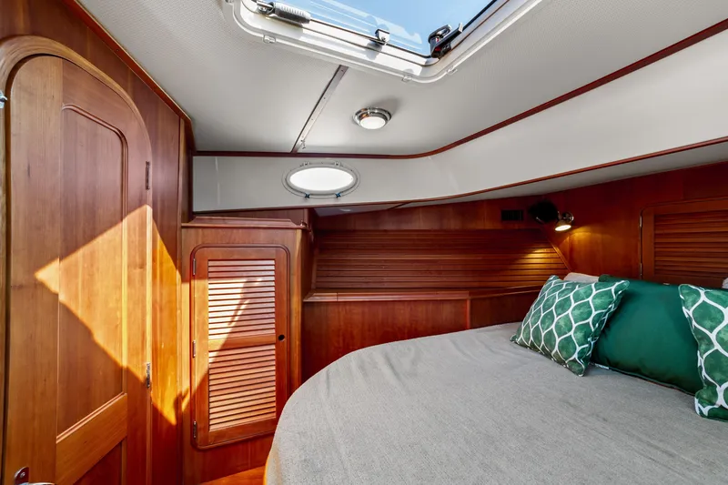 Slide: The Image of Luxurious cabin interior of 2002 Hinckley Talaria 44 Express yacht with wooden finish. - 43