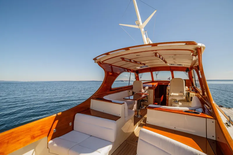 Slide: The Image of 2002 Hinckley Talaria 44 Express yacht interior with elegant seating and ocean view. - 19