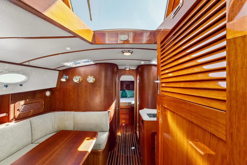 Slide: The Image of Luxurious interior of 2002 Hinckley Talaria 44 Express yacht with polished wood finish. - 30