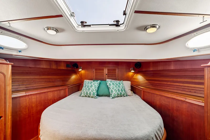 Slide: The Image of Luxurious cabin interior of 2002 Hinckley Talaria 44 Express yacht with cozy bedding. - 40