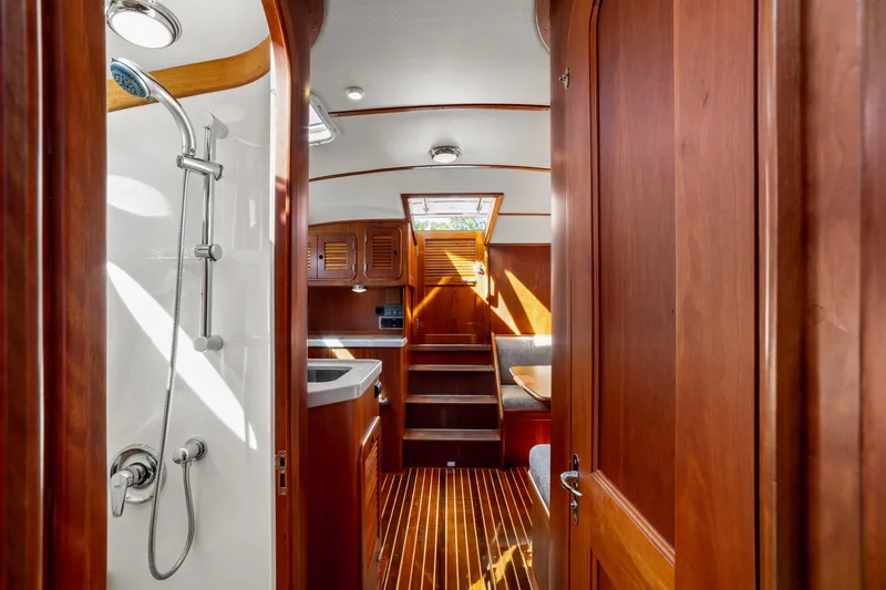 Slide: The Image of Luxurious 2002 Hinckley Talaria 44 Express yacht interior with wooden finish and shower. - 50