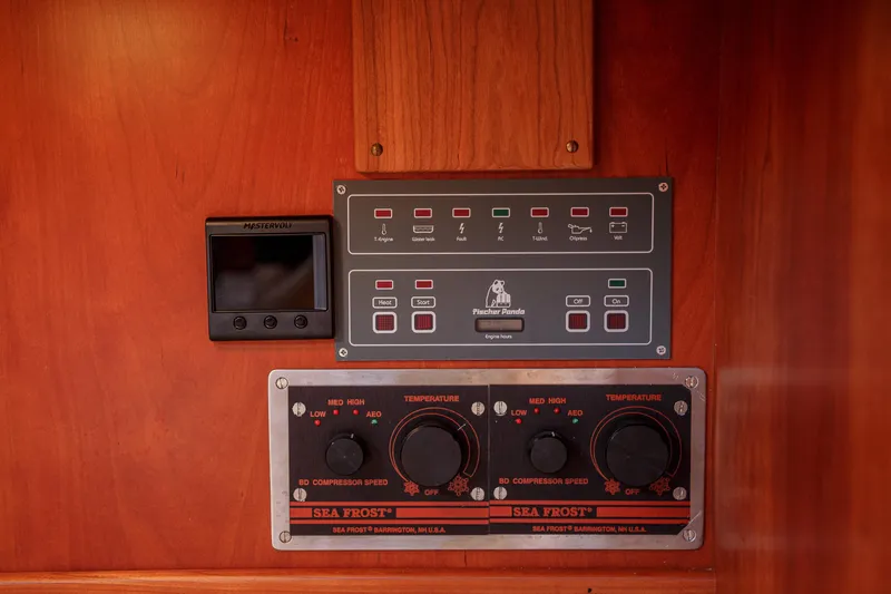 Slide: The Image of Control panel on 2002 Hinckley Talaria 44 Express yacht, featuring Fischer Panda and Sea Frost systems. - 53