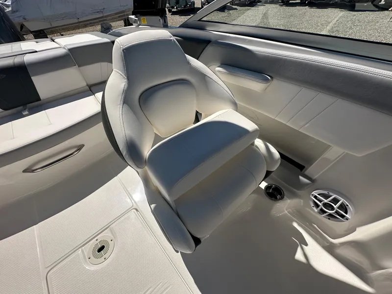 Slide: The Image of 2024 Chaparral 21 SSi OB boat interior with white seating and speaker. - 20