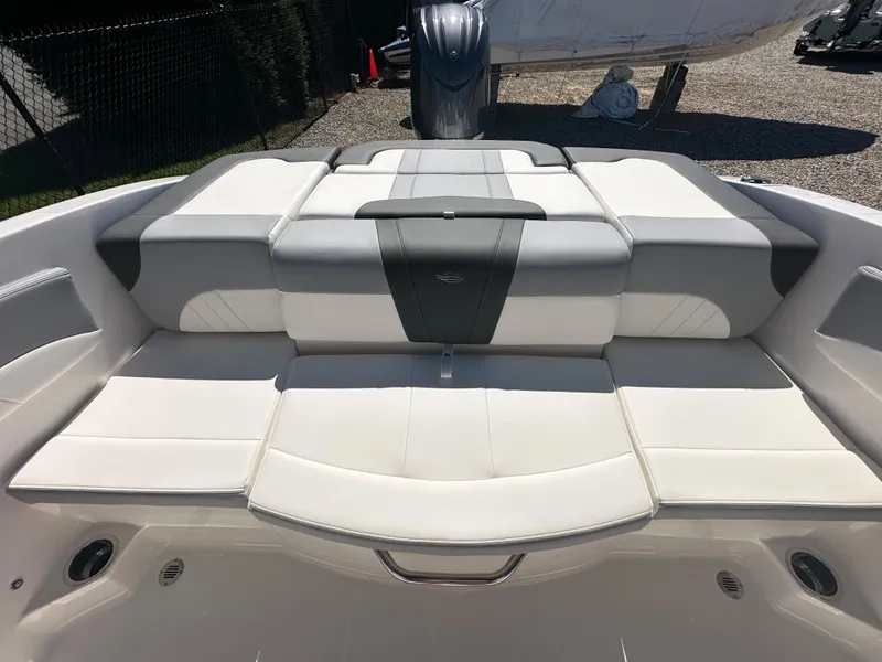 Slide: The Image of 2024 Chaparral 21 SSi OB boat with spacious, cushioned seating area. - 28