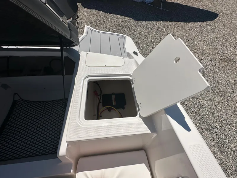 Slide: The Image of 2024 Chaparral 21 SSi OB boat storage compartment with open hatch. - 36