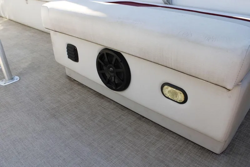 Slide: The Image of 2021 SunCatcher Select 22C boat interior with speaker and light on cushioned seating. - 30