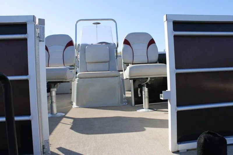 Slide: The Image of 2021 SunCatcher Select 22C pontoon boat interior with seating and console. - 5