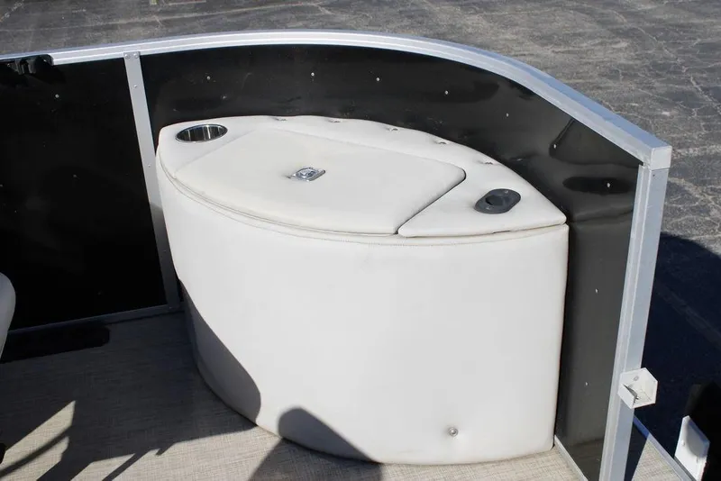 Slide: The Image of 2021 SunCatcher Select 22C boat interior with cushioned seating and cup holder. - 7