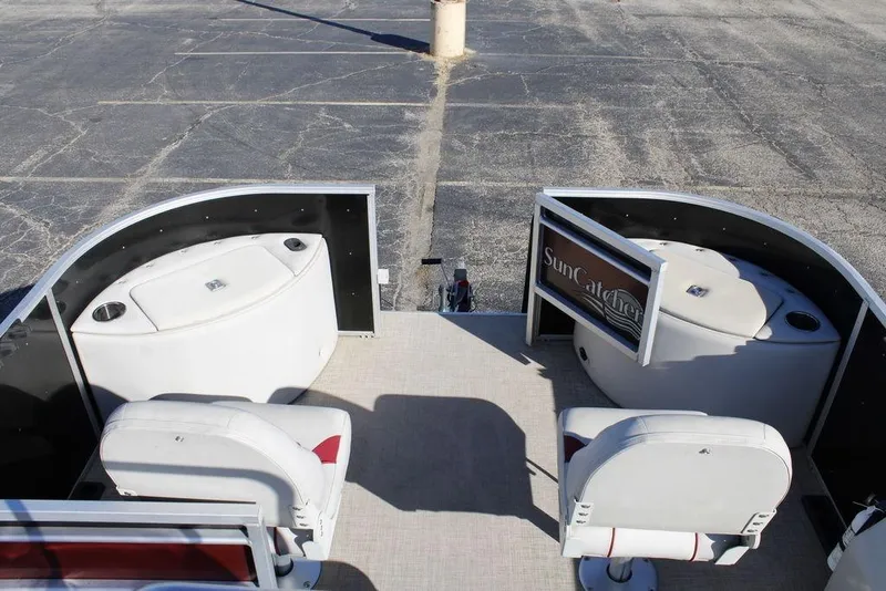 Slide: The Image of 2021 SunCatcher Select 22C pontoon boat interior with seating and storage compartments. - 8