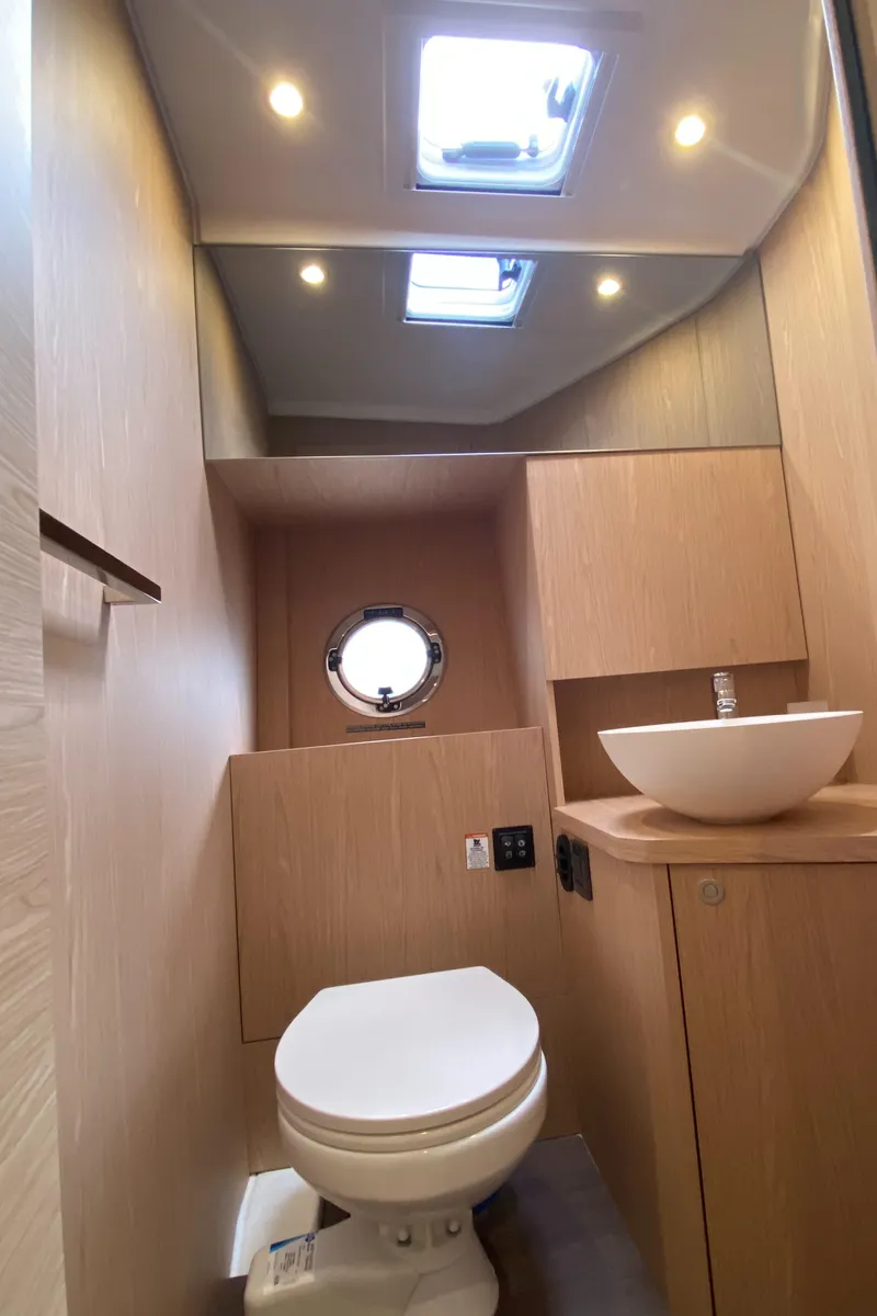 Slide: The Image of Modern bathroom in 2026 Beneteau 41 Swift Trawler FLY with skylight and porthole. - 35