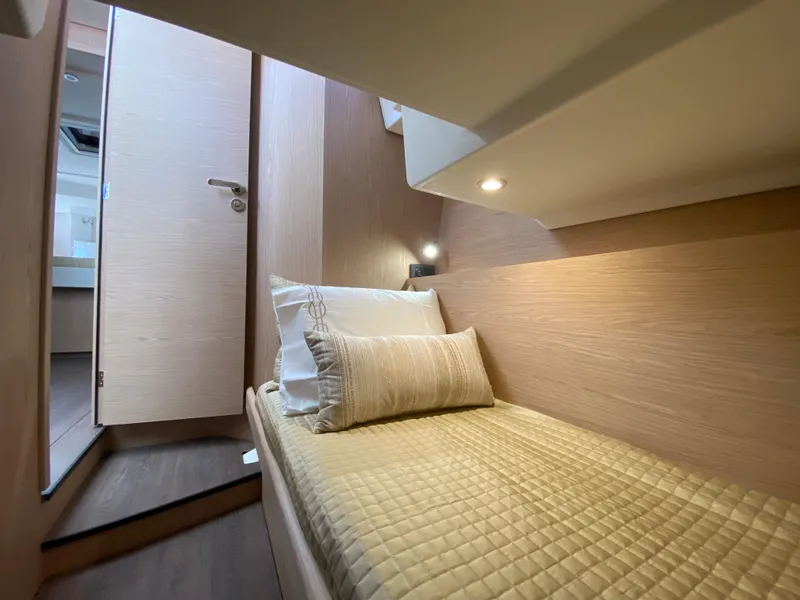 Slide: The Image of Cozy cabin interior of 2026 Beneteau 41 Swift Trawler FLY with modern bedding. - 37