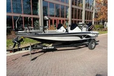 Slide: The Image of 2017 Nitro Z18 boat parked outdoors near a building. - 0