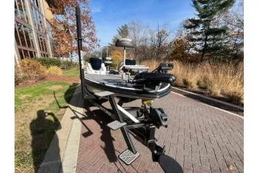 Slide: The Image of 2017 Nitro Z18 boat parked on a brick path, surrounded by autumn trees. - 3