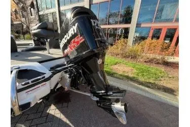 Slide: The Image of 2017 Nitro Z18 boat with Mercury Pro XS outboard motor, parked outdoors. - 4