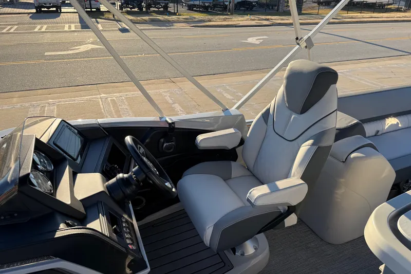 Slide: The Image of Luxurious helm of 2026 Avalon Catalina Entertainer boat with modern controls and comfortable seating. - 13