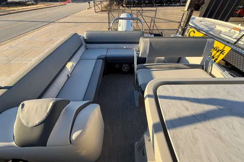 Slide: The Image of 2026 Avalon Catalina Entertainer boat interior with luxurious seating and table setup. - 25