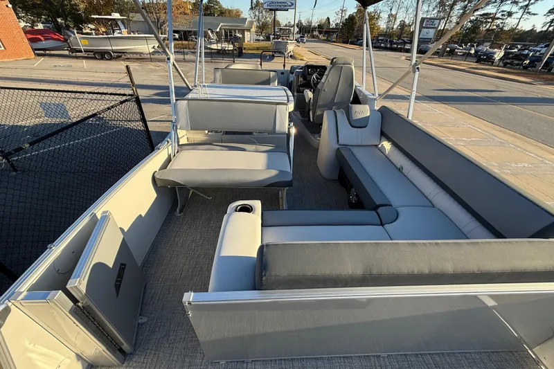 Slide: The Image of 2026 Avalon Catalina Entertainer pontoon boat interior with gray seating and helm. - 26
